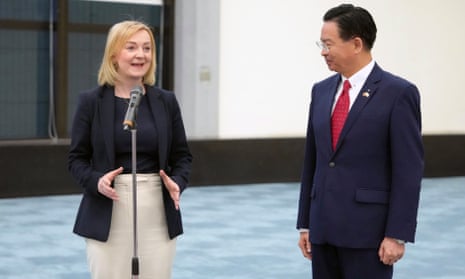 Former prime minister Liz Truss stands alongside Taiwan foreign minister Joseph Wu following her arrival in Taiwan on Tuesday