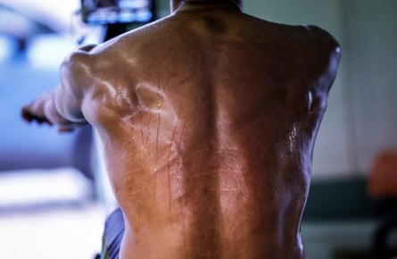 Martin Amethier, a Swedish member of the Cambridge University Boat Club, who is in the reserve Goldie crew, sweats profusely during a long session on an ergo machine at the Goldie boathouse, Cambridge in February 2024.