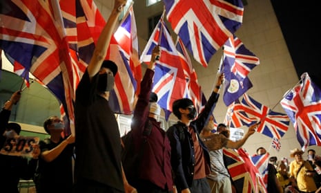 Anti-government demonstrators hold union jacks in a protest in front of the UK consulate in Hong Kong last year.
