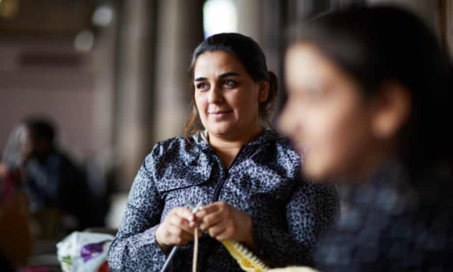 Asylum seeker Bakhtawer learning to knit at a British Red Cross drop-in session in Rochdale