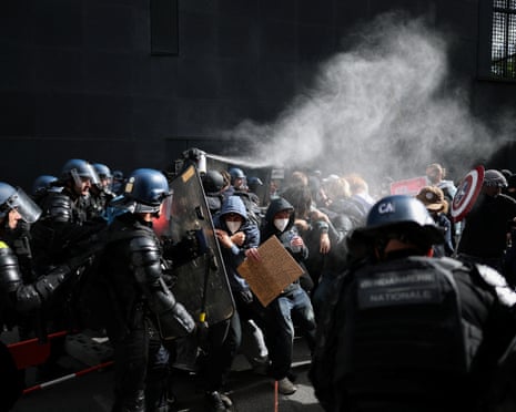 Protesters clash with French gendarmes, as French high school and university students attend a demonstration in Nantes.