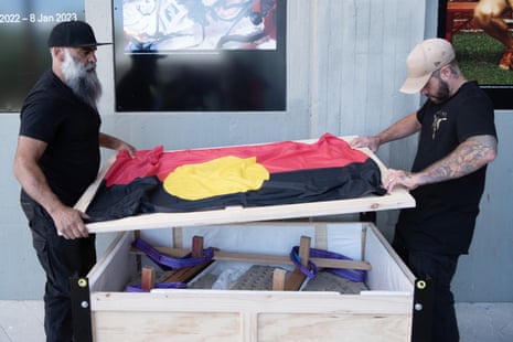 Shannon and Jesse Williams lift the lid on the crate housing the luwamakuna (rock carvings) being returned to Aboriginal ownership at Queen Victoria Museum in Launceston