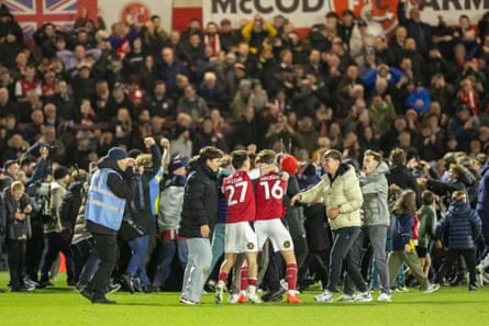 Pitch invasion on at Fleetwood following the defeat of Arsenal.