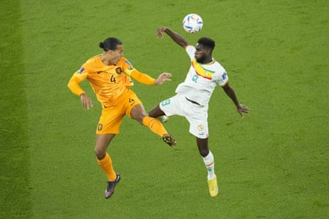 Virgil van Dijk and Senegal's Boulaye Dia in formation.