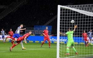 Hertha Berlin’s Vedad Ibisevic thumps a header past goalkeeper Gikiewicz.