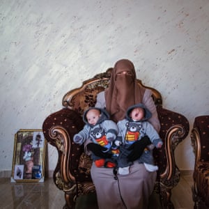 A woman with twin infants