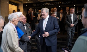 Garrick Club member Stephen Fry shakes hands with a well-wisher after the vote to allow women to join.