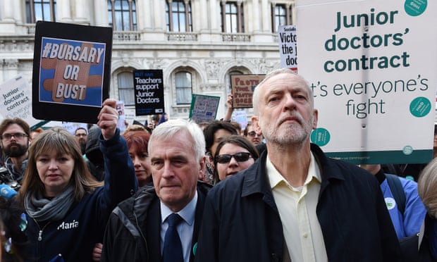 Jeremy Corbyn and John McDonell march with junior doctors in London on Tuesday during a strike over a proposed contract.