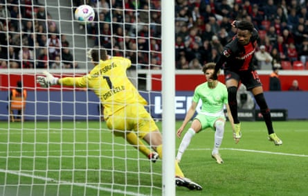 Nathan Tella of Bayer Leverkusen scores his teams first goal during the Bundesliga match between Bayer Leverkusen and VfL Wolfsburg in March 2024.