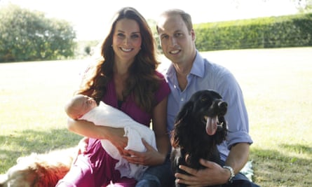 Duke and Duchess of Cambridge as they sit with their son Prince George in the garden of the Middleton family home in Bucklebury, Berkshire