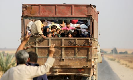 Kurdish Syrian civilians flee the town of Kobane on the Turkish border in October after the US declined to assist troops.