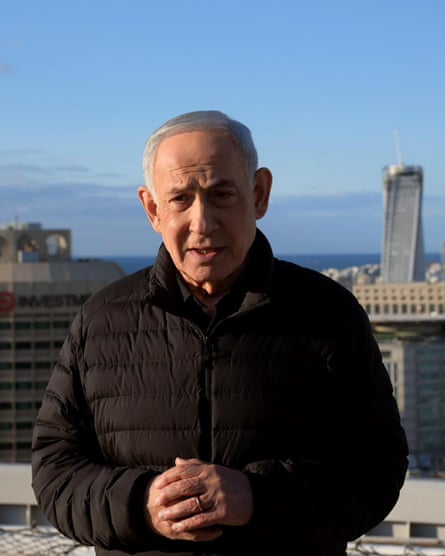 Netanyahu speaking while standing on a rooftop