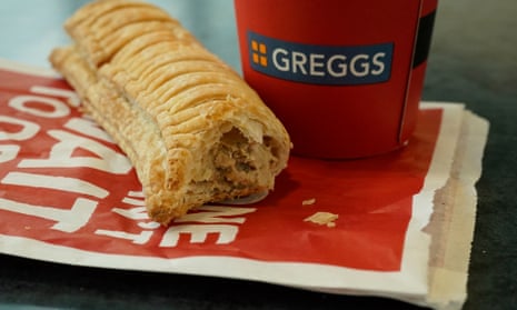 A Greggs vegan sausage roll and drink cup