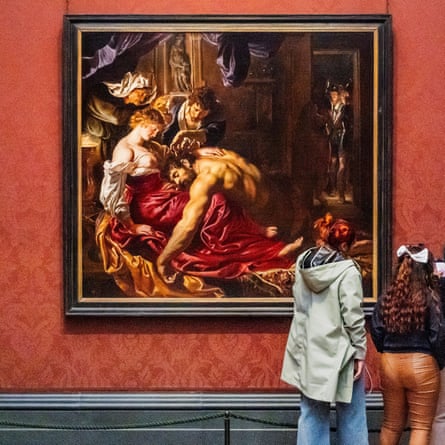 Visitors admire Samson and Delilah by Peter Paul Rubens at the National Gallery in London.