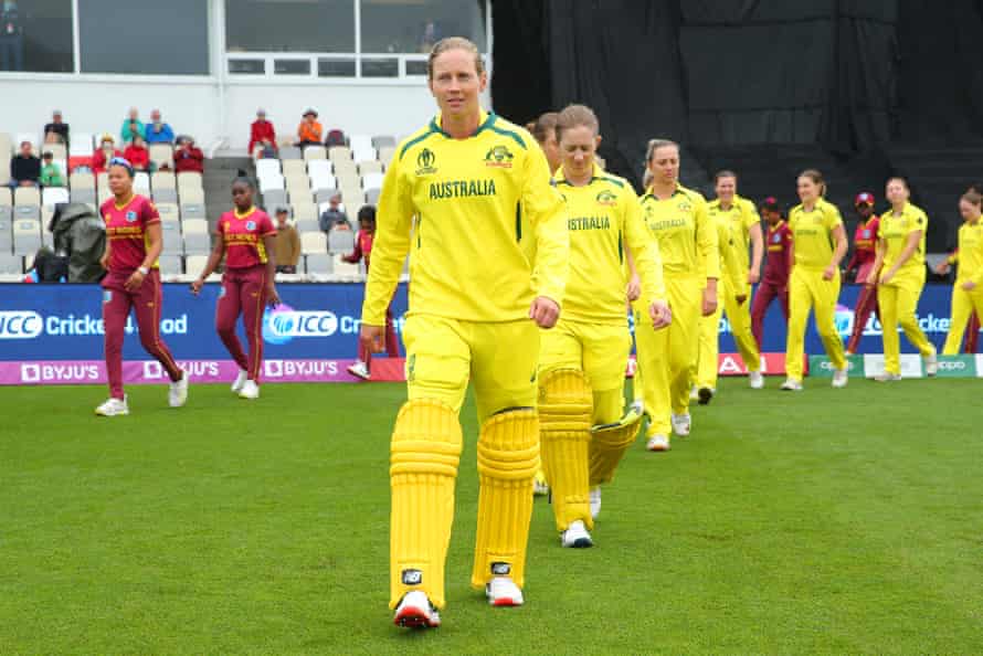 Captain Meg Lanning leads Australia to the field before the 2022 ICC Women's Cricket World Cup match against the West Indies.