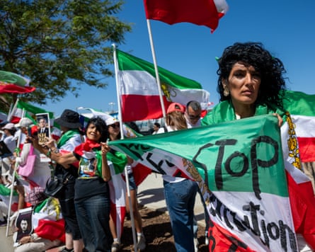 Crowd of people waving flags