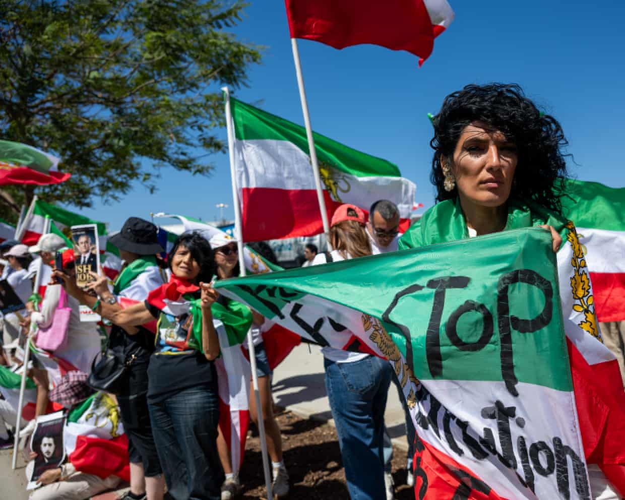 Crowd of people waving flags
