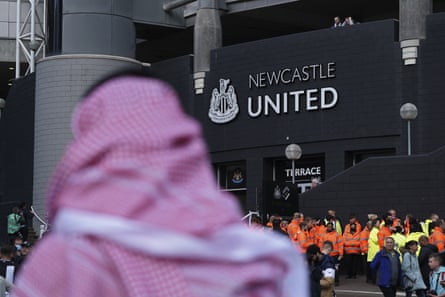A fan with a Saudi Arabian headdress passes St James’ Park shortly after the takeover.