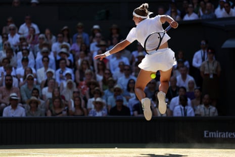 Karolina Muchova hits a volley behind her back