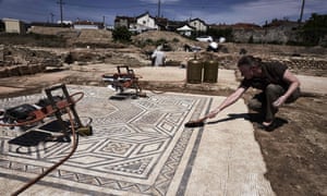 An archaeologist works on a mosaic on the archaeological antiquity site of Sainte-Colombe, near Vienne.