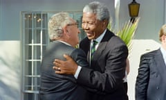 President Nelson Mandela, right, gives former US secretary of state Henry Kissinger a welcome hug, Johannesburg, April 1994.