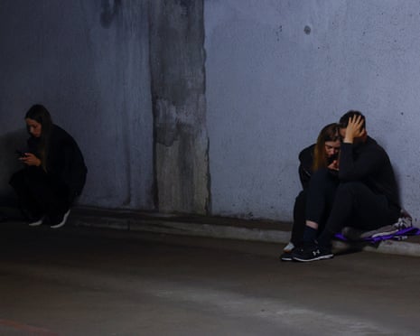 Residents gather in an underground parking lot during the strikes