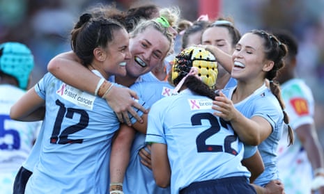 NSW Waratahs celebrate scoring a try in their 50-14 victory over Fijian Drua in the Super Rugby Women's grand final at Ballymore Stadium