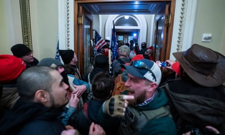Supporters of Donald J Trump outside the door to the House chamber after breaching Capitol security on 6 January.