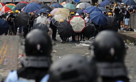 Protesters face police during a mass protest in Hong Kong on Wednesday.