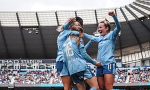 Manchester City players celebrate during their 3-1 win over Manchester United.
