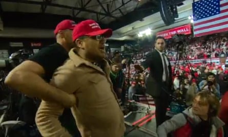 A man is restrained at a recent Trump rally in Texas, following an assault on a cameraman.