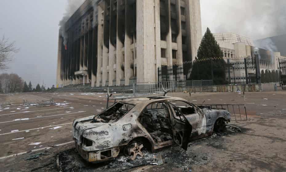 A burned car in front of the mayor’s office building which was torched during protests in Almaty, Kazakhstan