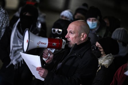 A man speaks into a megaphone