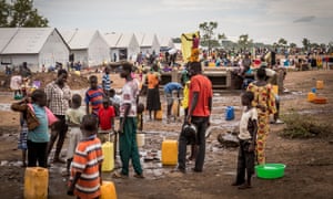 People at Bidi-Bidi camp in northern Uganda collect water from a tap provided by the UNHCR