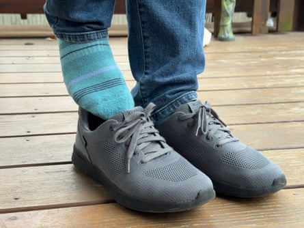 A person putting on a pair of Kizik Lima Shoes