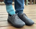 A person putting on a pair of Kizik Lima Shoes