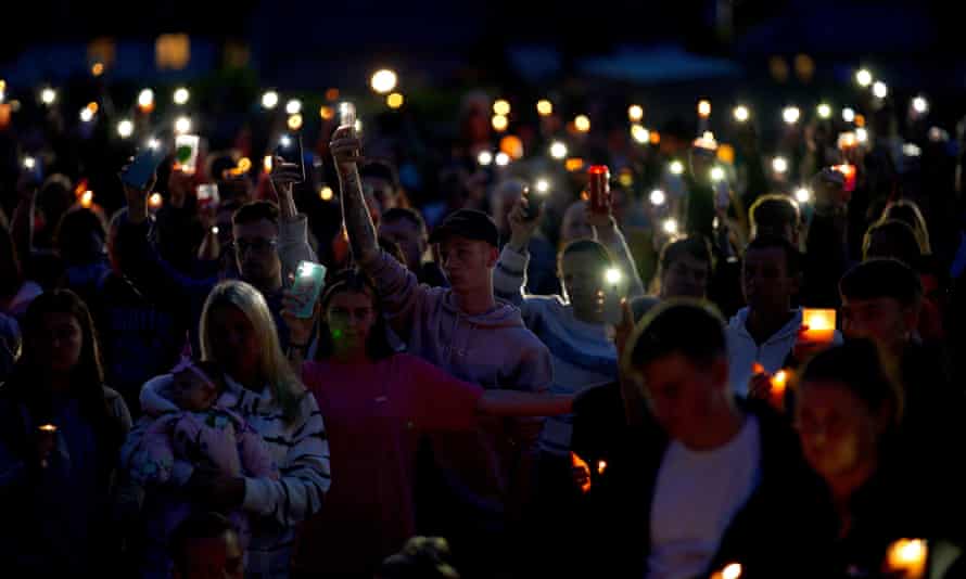 a vigil for the victims of the mass shooting in Plymouth