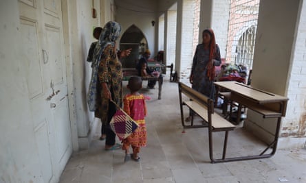 Women and children in the Larkana girls school building.