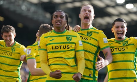 Norwich City's Sam McCallum and Ashley Barnes celebrate an own goal by Plymouth Argyle's Ashley Phillips.