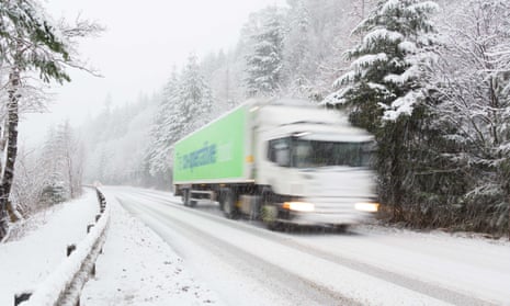 A lorry driver delivers food during the festive season in the Scottish Highlands. Hauliers say too few young people can afford to get a licence to drive lorries. 
