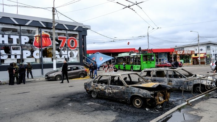 Damaged cars at the scene of the attack.