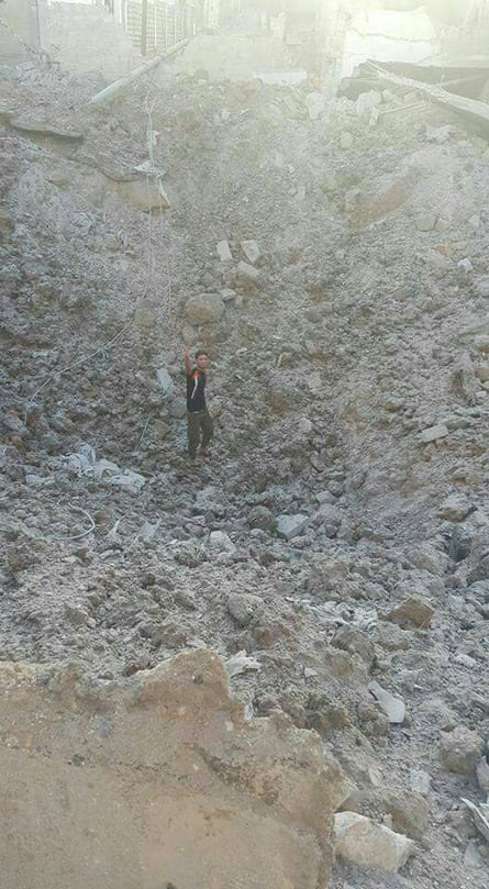 The crater left by the explosion of an alleged bunker-buster bomb in Tariq al Bab neighbourhood.