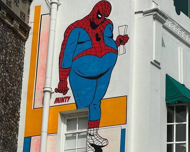 A mural of an overweight Spider-Man in Brighton