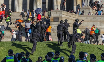 Riot police disperse the crowds at the Shrine of Remembrance during Melbourne’s lockdown on Wednesday.