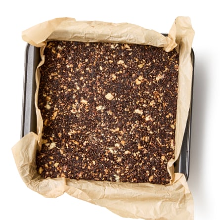 Put the doughy mixture into the lined tin and pat down firmly into an even, flat layer.