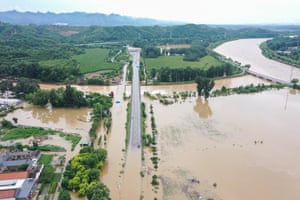 A partly submerged road is seen from above