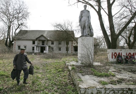 An abandoned building and a second world war monument in the village of Tulgovichi, which is inside ‘the zone’; now there are only eight