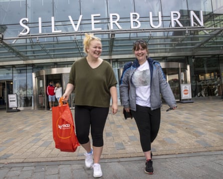 The Silverburn sign can be seen as shoppers leave the shopping centre after it reopened to customers following the lifting of Covid restrictions