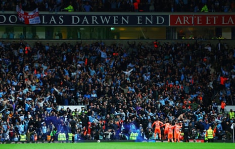 Coventry City fans celebrate their team’s equaliser at Blackburn.