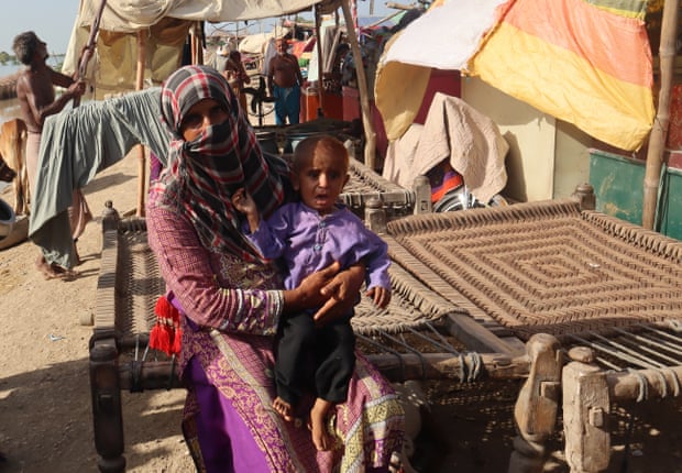 Ghulam e Kubra, with her son the Superio embankment, says children are falling sick and they are helpless